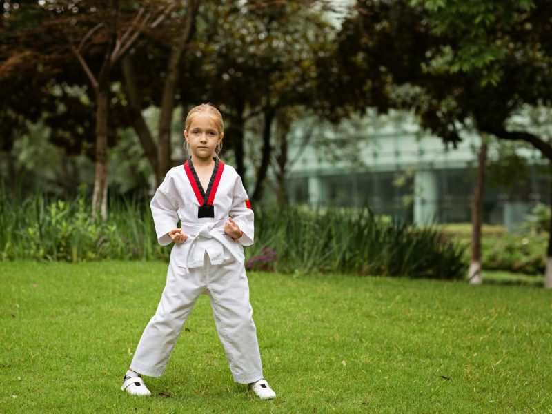 Kid exercising taekwondo outdoor